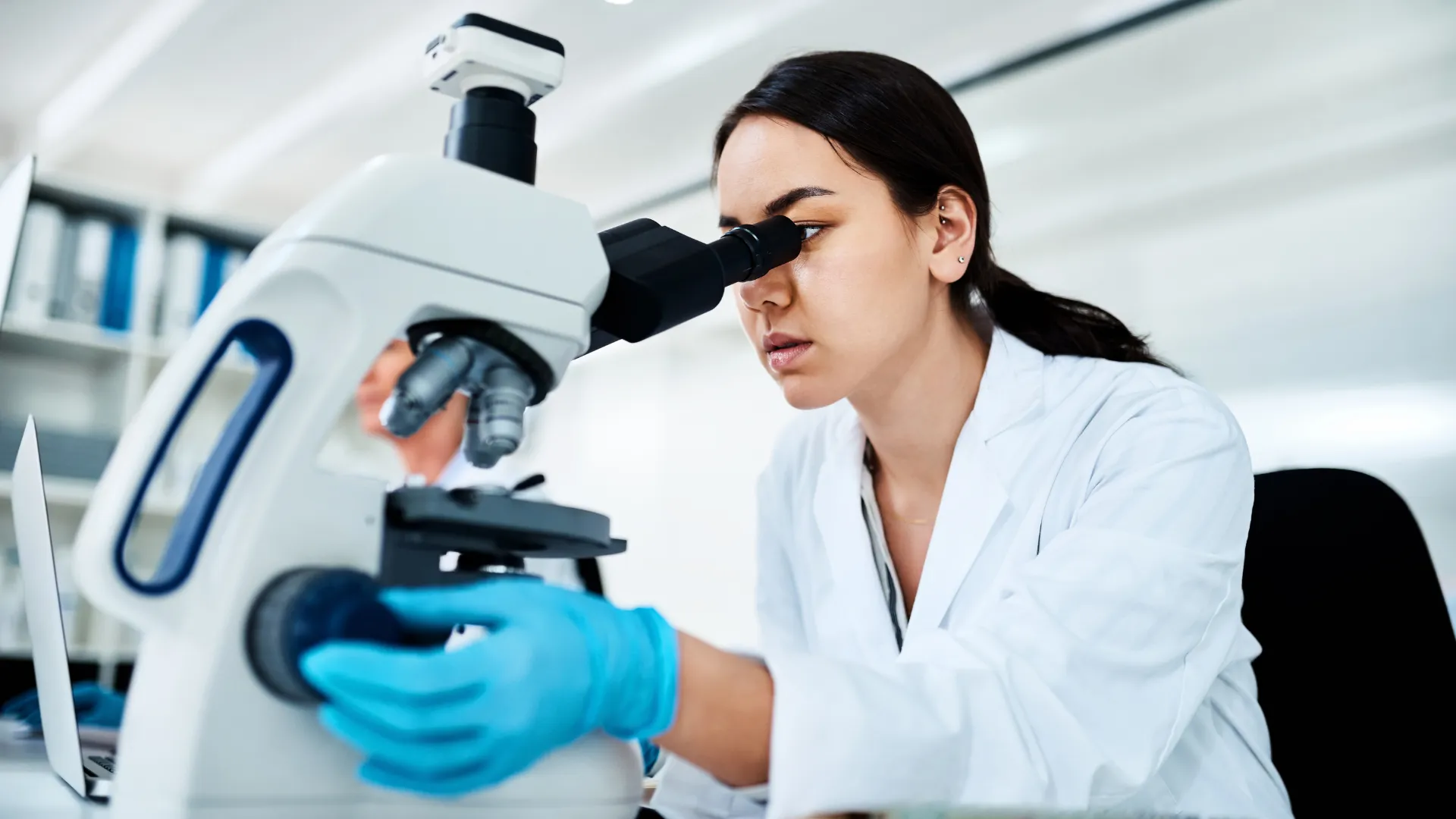 Scientist examining a sample in the lab